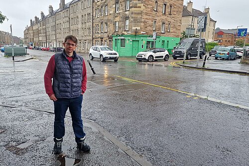 A man standing at a junction