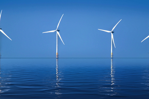 Offshore Wind Turbines Against Clear Blue Sky View more by John Lines from Pexels