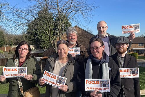 Lib Dem FOCUS Team members with leaflets about Care Link