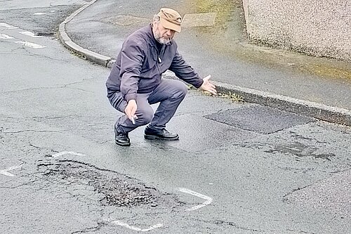 Steve Guy showing pothole 
