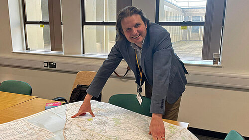 Steff looking at map of walking routes
