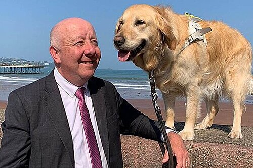 Steve Darling MP for Torbay with Jennie the dog on the sea front