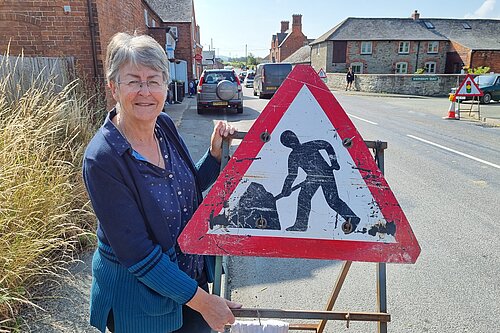 Councillor Heather Kidd examines road works in South Shropshire